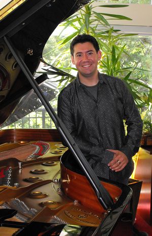 Ian Parker in his studio with one of his Steinways